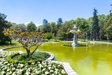 ISTANBUL, TURKEY - MAY 13, 2018: visitors near fountain in garden of Dolmabahce Palace in Istanbul city. The Palase was main administrative center of the Ottoman Empire in 1856-1887 and 1909-1922のeditorial素材