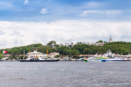 ISTANBUL, TURKEY - MAY 11, 2018: excursion ships near pier in Golden Horn bay in Istanbul city. Istanbul is the most populous city and the economic, cultural, and historic center in Turkeyのeditorial素材