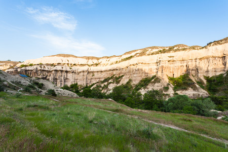 Travel to Turkey - green meadow in gorge near Goreme town in Cappadocia in springの写真素材