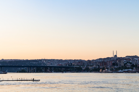 Travel to Turkey - view of Halic Bridge (Golden Horn Bridge) in Istanbul city in spring eveningの写真素材