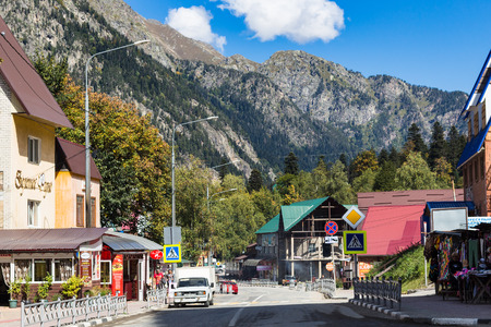 DOMBAY, RUSSIA - SEPTEMBER 22, 2018: people on street in Dombay resort village in Teberda Nature Reserve in Caucasus Mountains in Karachay-Cherkessia region of Russiaのeditorial素材