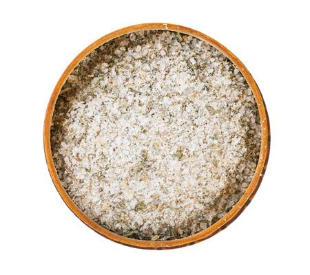 top view of wooden salt cellar with seasoned salt with spices and dried herbs isolated on white backgroundの写真素材