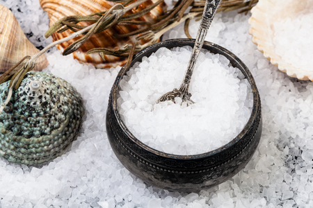 salt cellar with spoon, shells and coarse grained Sea Salt close upの写真素材