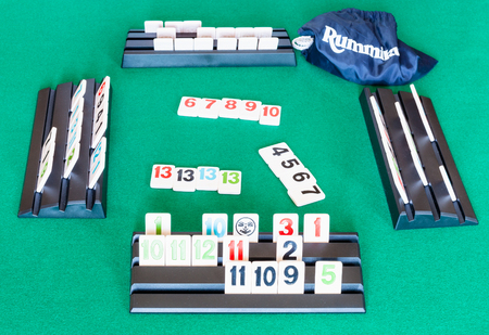 MOSCOW, RUSSIA - APRIL 3, 2019: playfield of Rummikub tile-based game on green baize table. Rummikub was invented by Ephraim Hertzano, the game was first made by Lemada Light Industries Ltd in 1978のeditorial素材