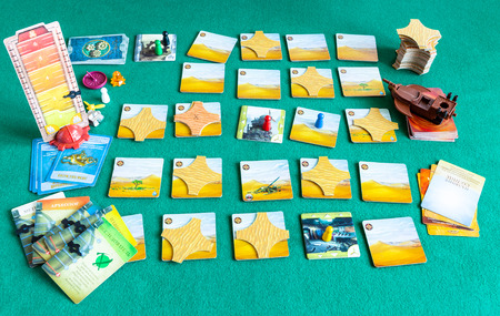 MOSCOW, RUSSIA - APRIL 3, 2019: gameplay in Forbidden Desert cooperative board game (russian edition). The game was developed by Matt Leacock and published by Gamewright Games in 2013のeditorial素材