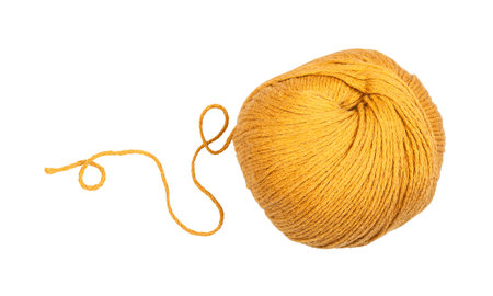 Skein of yellow yarn with unwound tail isolated on white