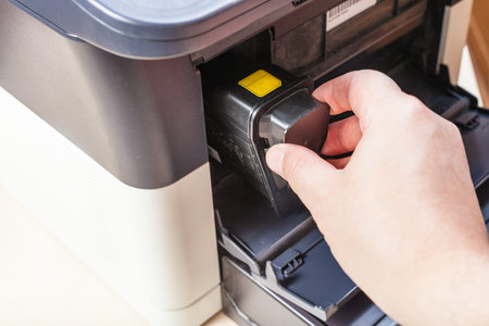 replacement of toner cartridge in laser multi function device in office