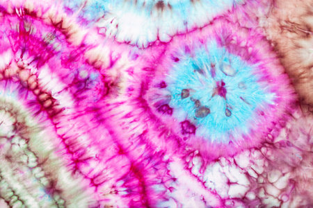 part of abstract bright pattern in tie-dye batik technique handpainted on silk head scarf