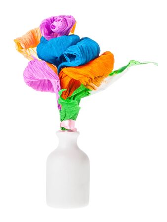 handmade artificial multicolored flowers made of crepe paper in white ceramic bottle isolated on white backgroundの写真素材