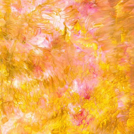 square paper background colored by yellow and pink acrylic paintsの写真素材