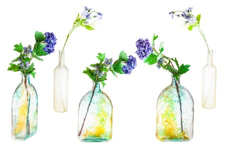 set of artificial flowers in hand painted glass bottles isolated on white backgroundの写真素材