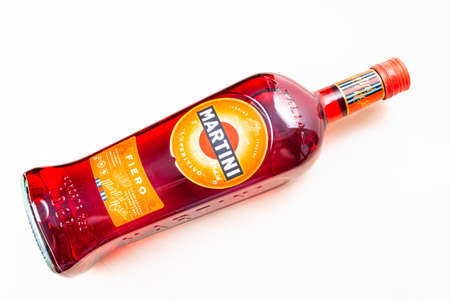 MOSCOW, RUSSIA - MAY 10, 2020: full bottle of Martini Fiero on light brown board. Martini is classic Italian vermouth from Turin city, now this brand belongs to Bacardi Groupのeditorial素材