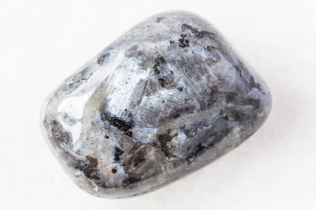 closeup of sample of natural mineral from geological collection - tumbled Larvikite (norwegian...