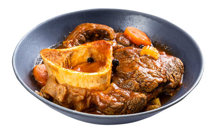 portion of osso buco (beef shin braised with vegetables, wine and broth) in gray bowl isolated on white backgroundの写真素材
