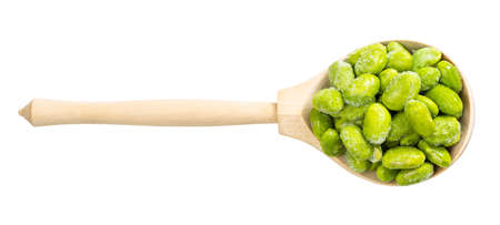 top view of frozen Edamame (unripe soybeans) in wood spoon isolated on white backgroundの写真素材