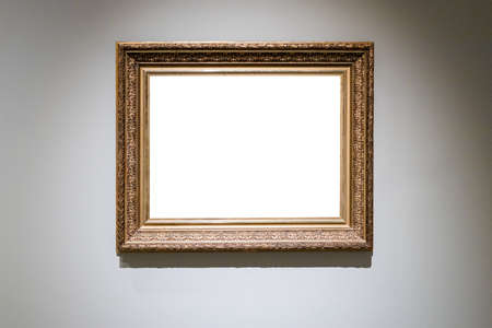 old carved wide wooden picture frame with cutout canvas on gray wallの写真素材