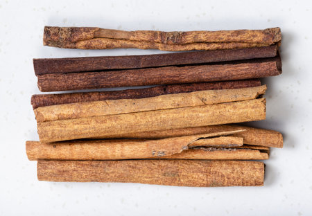 top view of cassia (chinese cinnamon) sticks close up on gray ceramic plate