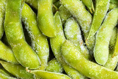 food background - many frozen Edamame (unripe soybeans) pods close upの写真素材