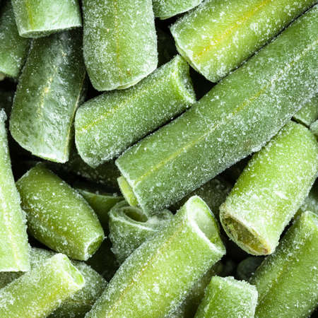 square food background  cut and frozen green beans close upの写真素材