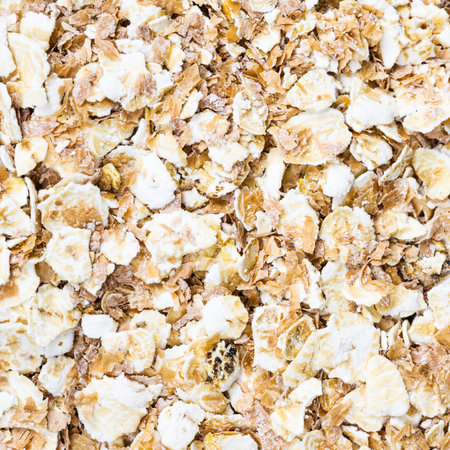 square food background oat flakes with rye bran close up