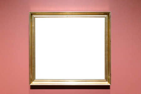 classical golden picture frame with cutout canvas on pink wallの写真素材