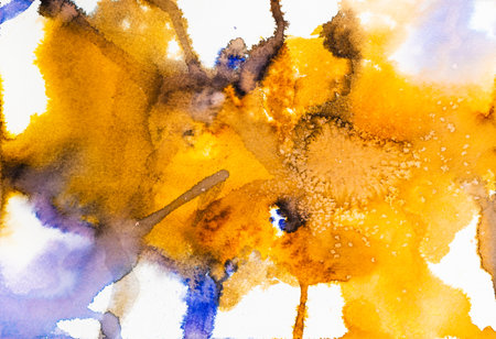 abstract hand-painted orange watercolor spots with salt crystals on white paperの写真素材