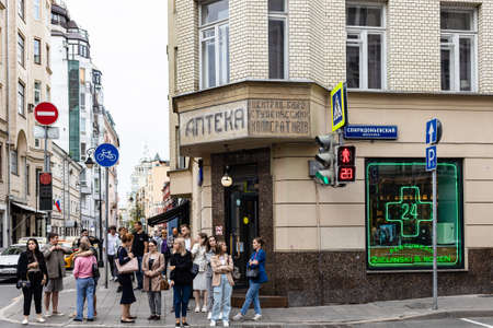 Moscow, Russia - August 21, 2021: people on corner of Malaya Bronnaya Street and Spiridonievsky Lane in center of Moscow city in summer overcast evening.のeditorial素材