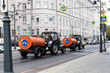 Moscow, Russia - August 23, 2021: municipal watering machines on Malaya Dmitrovka street in Moscow...
