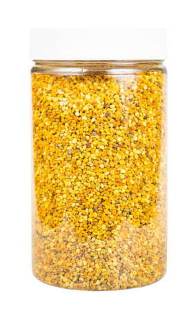 side view of closed large glass jar with natural bee pollen isolated on white backgroundの写真素材