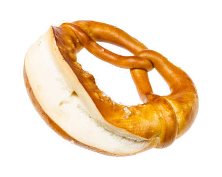 front view of laugenbrezel with salt isolated on white background