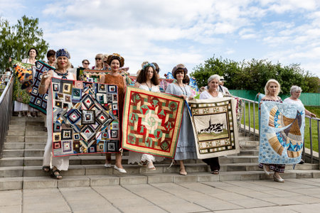 Kolomna, Russia - June 11, 2022: procession with handmade patchwork quilts during International...