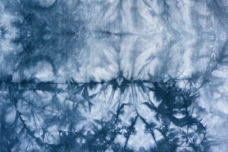 gray abstract pattern handcrafted in tie dye technique on cotton jersey fabricの写真素材