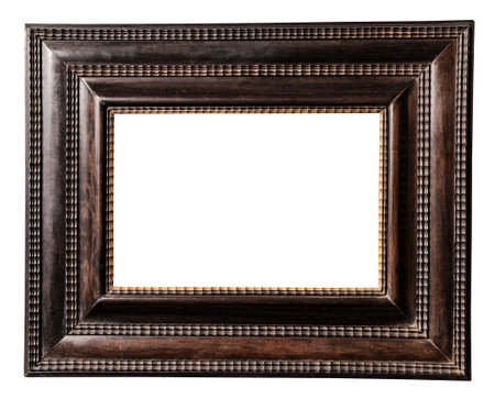 old very wide dark brown wooden picture frame isolated on white background with cut out canvas