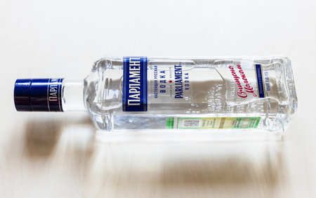 Moscow, Russia - August 2, 2022: lying bottle of russian Parliament vodka on pale table. The trade mark Parliament belongs to Roust holding, second largest producer of vodka in the worldのeditorial素材