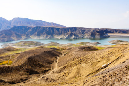 dam and water Azat reservoir on river in mountains of Armenia on sunny autumn dayの写真素材