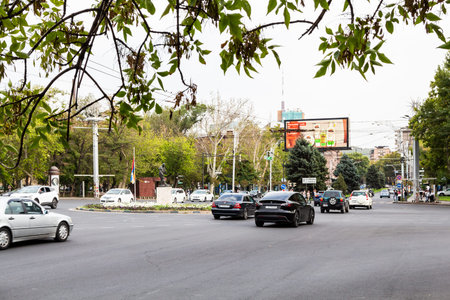 Yerevan, Armenia - September 29, 2023: car traffic of France Square with sculpture artist Jules...