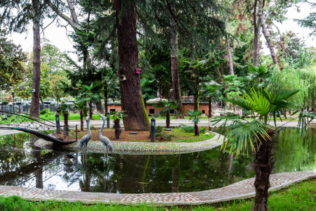 Batumi, Georgia - September 16, 2023: pond in Bird Zoo on seaside boulevard in Batumi city in autumnのeditorial素材