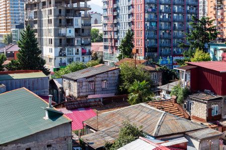 Batumi, Georgia - September 15, 2023: above view of residential district with unfinished high-rise house in Batumi city on sunny morningのeditorial素材