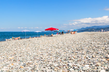 Batumi, Georgia - September 15, 2023: surface of urban pebble beach on Black Sea in Batumi city on sunny autumn dayのeditorial素材