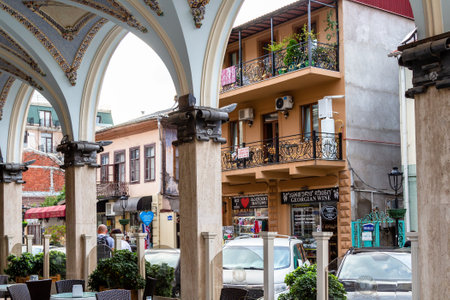 Batumi, Georgia - September 16, 2023: view of Parnavaz Mepe Street from arcades of Batumi Piazza square in downtown of Batumi city on autumn dayのeditorial素材