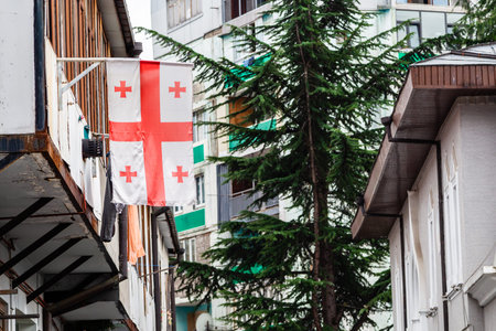 travel to Georgia - Georgian flag on balcony of residential building in Batumi city