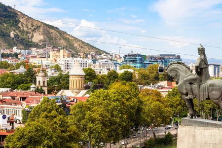 Tbilisi, Georgia - September 26, 2023: view of old Tbilisi city with Sioni cathedral and monument to King Vakhtang Gorgasali from Metekhi on sunny autumn dayのeditorial素材