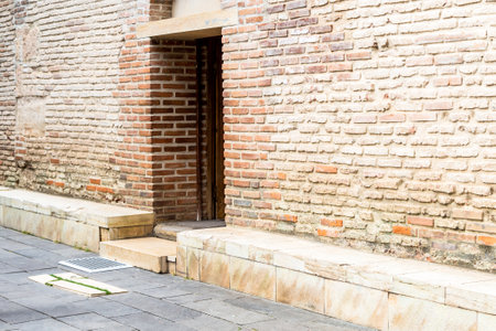 Bodbe, Georgia - September 24, 2023: side entrance to old Church of St George with tomb of St Nino in Bodbe Monastery in Kakheti region of Georgia on sunny autumn dayのeditorial素材