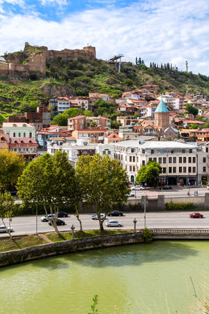 Tbilisi, Georgia - September 26, 2023: view of Kura river and old town from Metekhi viewpoint in Tbilisi city on cloudy autumn dayのeditorial素材