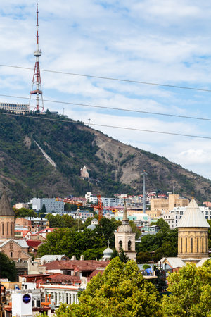 Tbilisi, Georgia - September 26, 2023: view of Georgia Tbilisi TV Broadcasting Tower on Mtatsminda mount over old town in Tbilisi city from Metekhi viewpoint on sunny autumn dayのeditorial素材