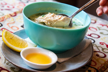 travel to Georgia - eating Chikhirtma (Georgian soup from chicken broth, thickened with beaten eggs and curd) in local cafe in Tbilisi cityの写真素材