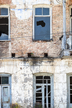 abandoned house with broken windows of Myasnikyan street in Dilijan city, Armenia on sunny summer dayの写真素材