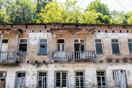 facade of abandoned house of Myasnikyan street in Dilijan city, Armenia on sunny summer dayの写真素材