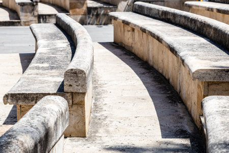 stone benches in outdoor amphitheater close up in Dilijan city, Armenia on sunny summer dayの写真素材
