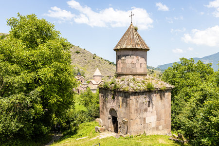 view of Saint Gevorg church and Goshavank monastery in backgrond, in Gosh village, Armenia on sunny summer dayの写真素材